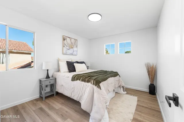 a bathroom with a double vanity sink mirror and toilet
