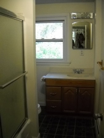 123 S Road Hampden, MA 01036 - Photo 24 of 28 a bathroom with a sink a mirror and a window