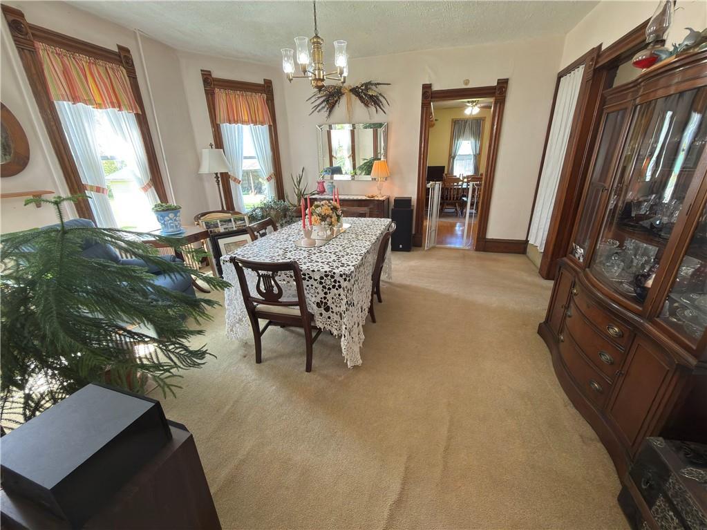 122 Coal Bank Road Greenville, PA 16125 - Photo 32 of 50 a dining room with furniture a chandelier and window