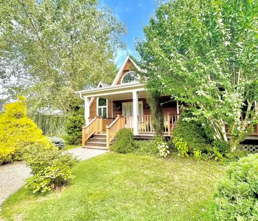 a view of front of house with a yard