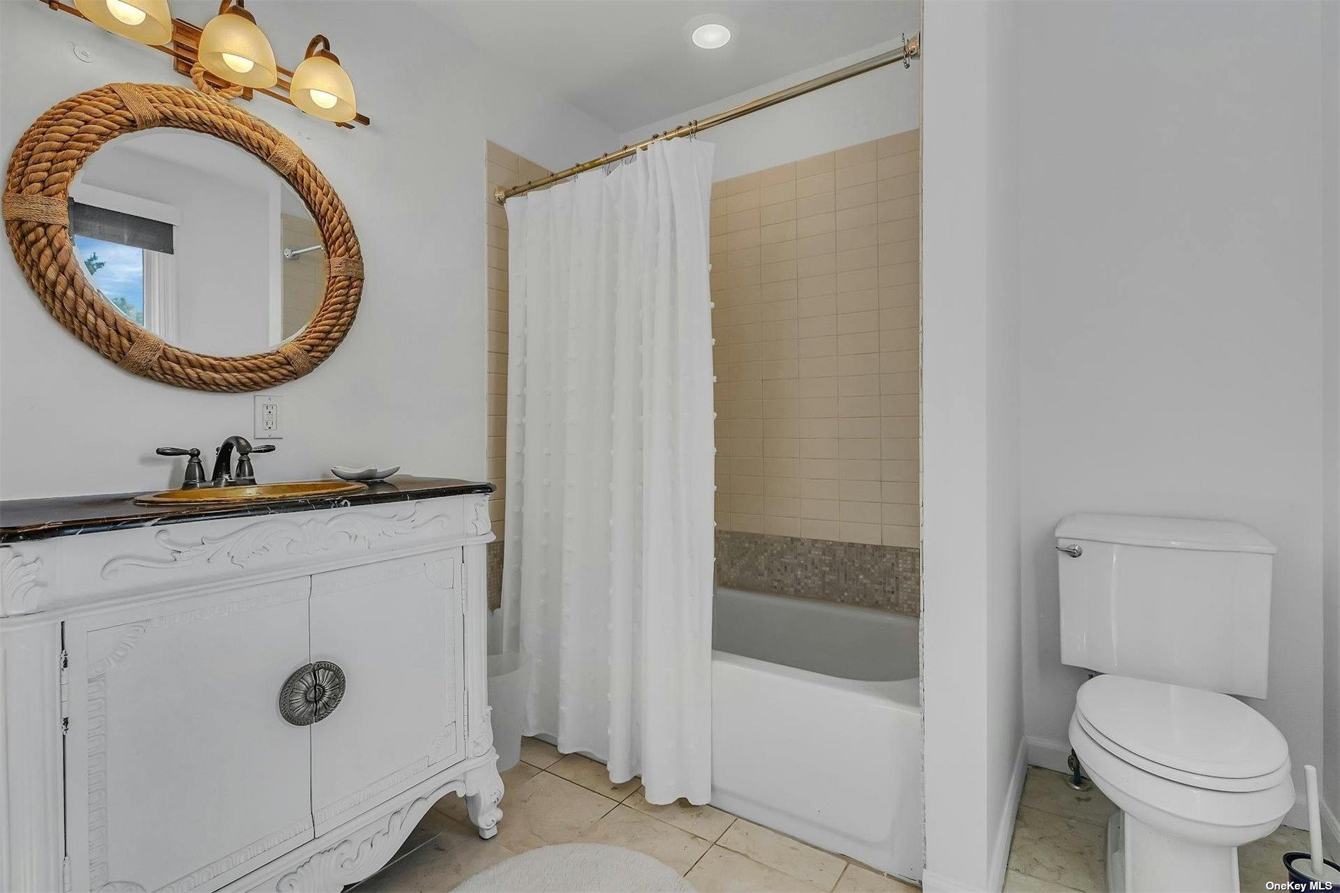 6 Nidzyn Avenue Remsenburg, NY 11960 - Photo 16 of 31 a bathroom with a toilet a sink and a mirror