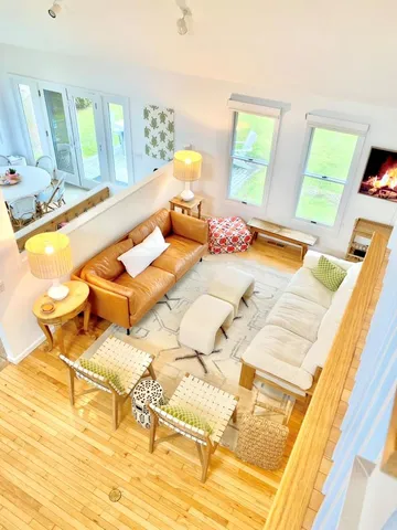 a backyard of a house with lots of green space and trees in the background