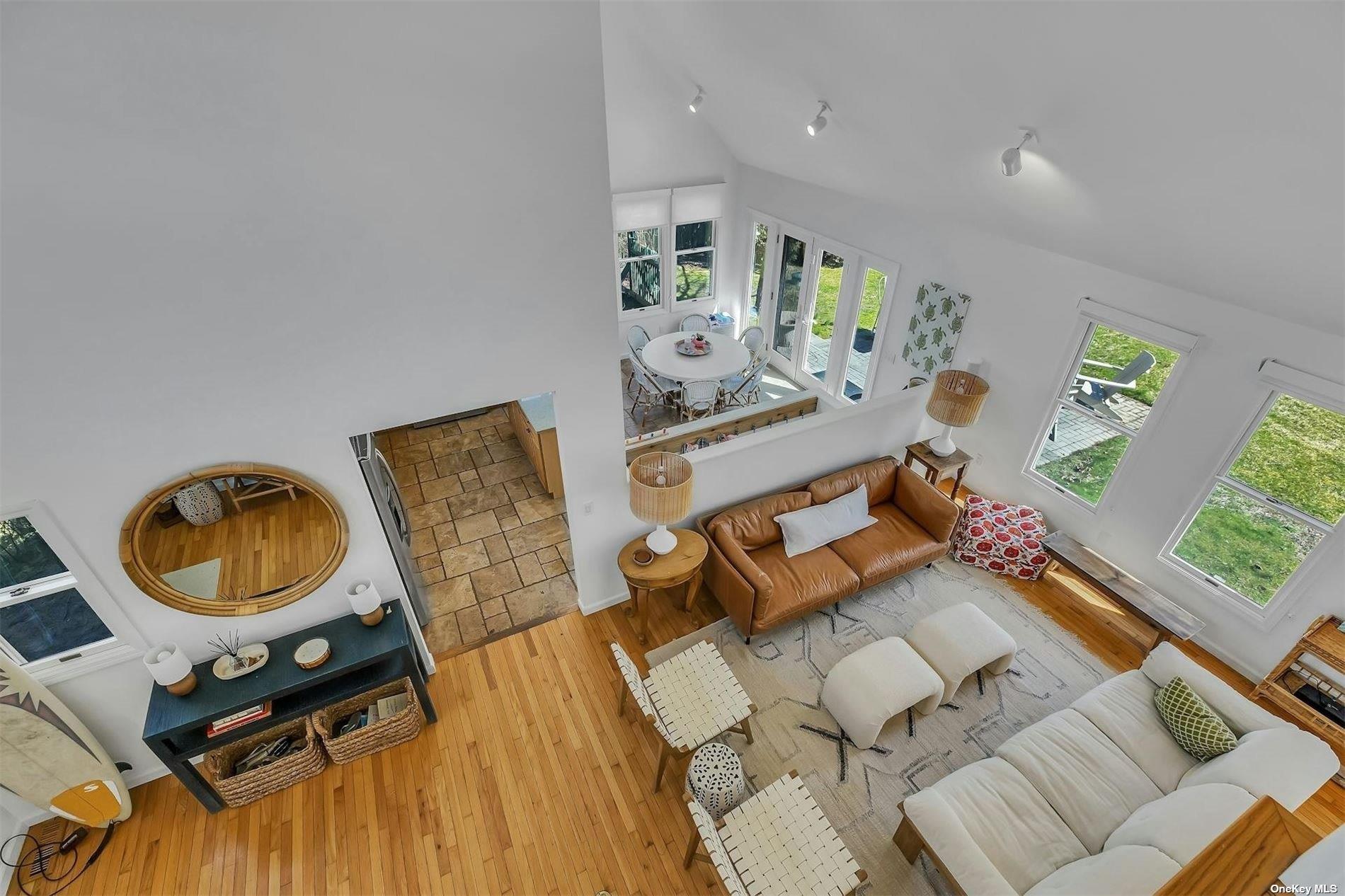 6 Nidzyn Avenue Remsenburg, NY 11960 - Photo 22 of 31 a living room with furniture and wooden floor