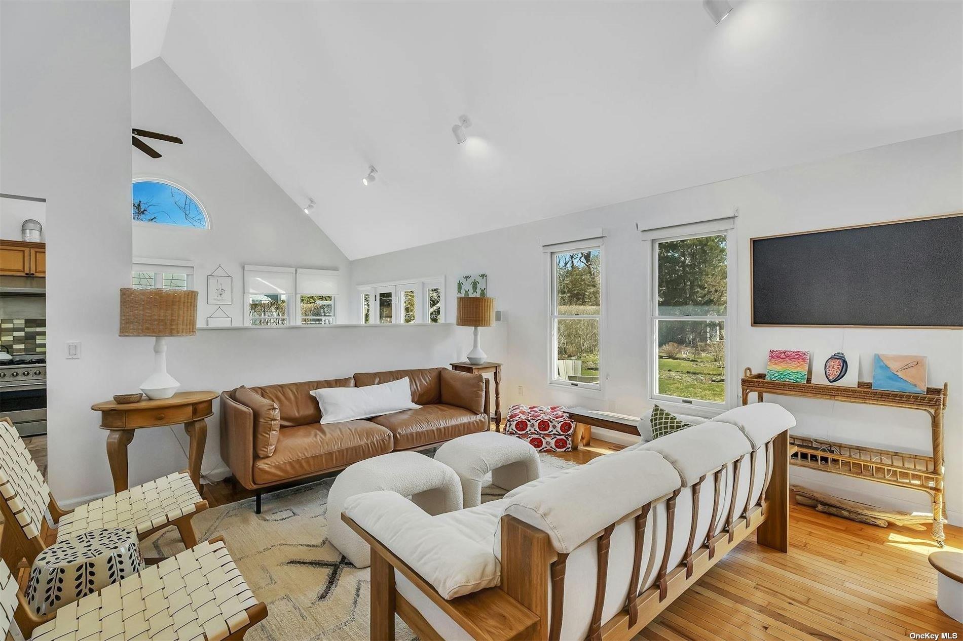 6 Nidzyn Avenue Remsenburg, NY 11960 - Photo 8 of 31 a living room with furniture and a flat screen tv
