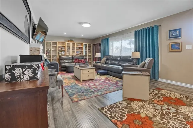 a living room with furniture and a rug