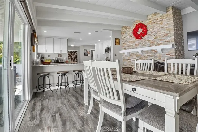a view of kitchen and dining room with wooden floor