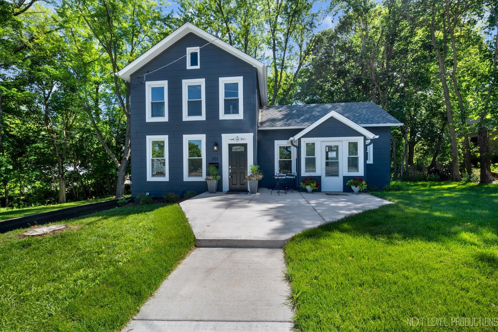 201 South Gilbert Street South Elgin, IL 60177 - Photo 2 of 27 a front view of a house with a yard
