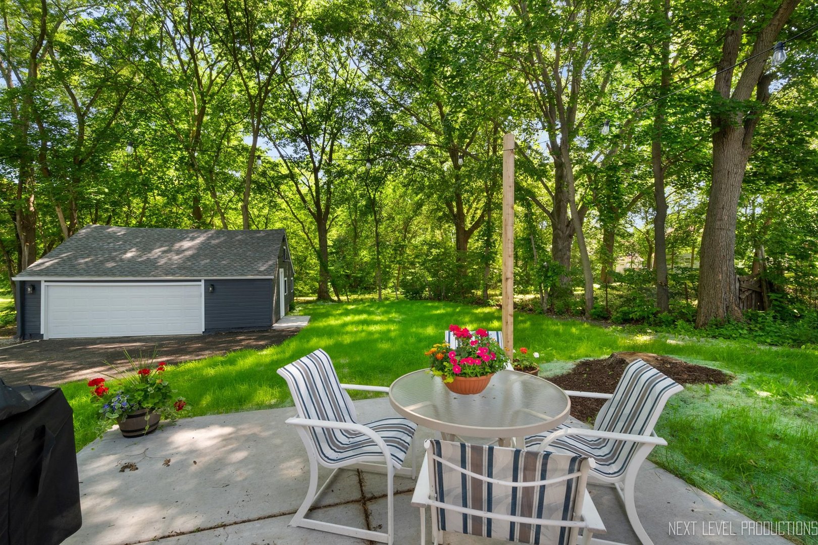 201 South Gilbert Street South Elgin, IL 60177 - Photo 26 of 27 a view of a chair and table in backyard of the house