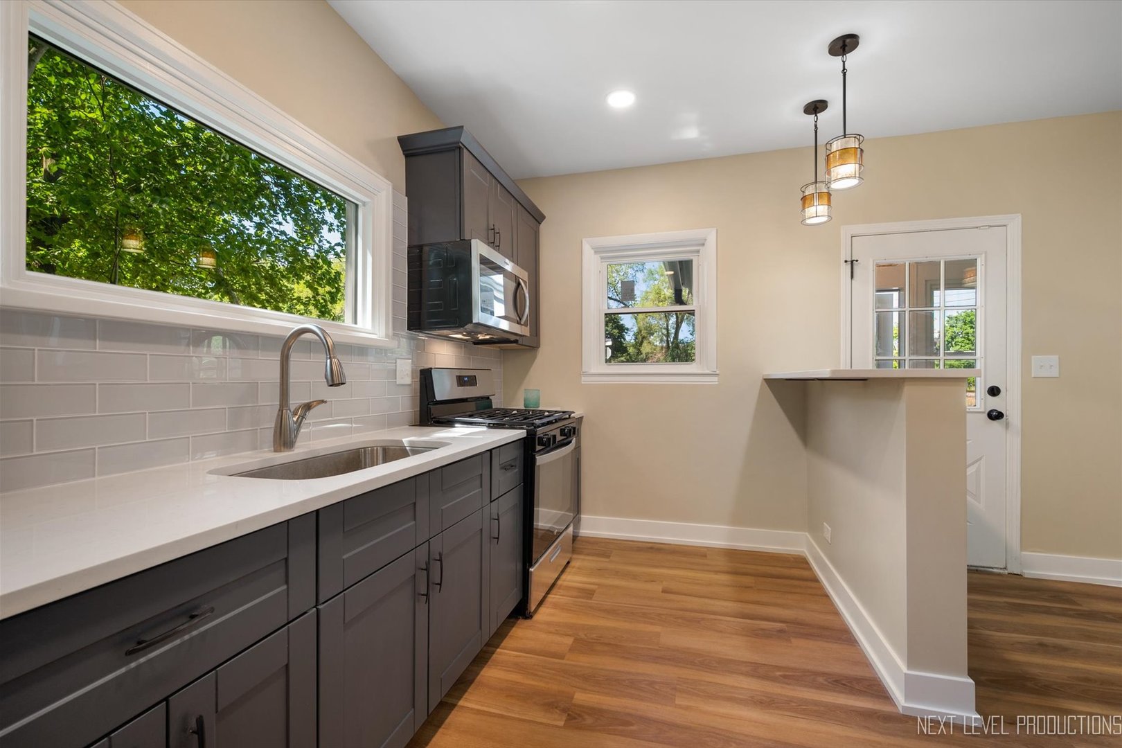 201 South Gilbert Street South Elgin, IL 60177 - Photo 10 of 27 a kitchen with a sink and window
