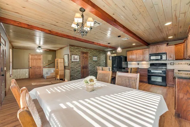 a bed room with a bed and a television