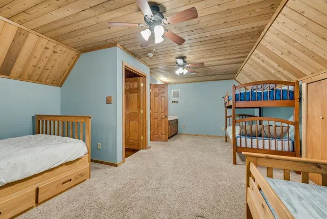 a view of a hallway with a bedroom