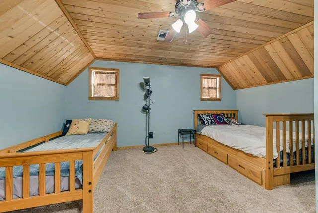 a bed room with a bed and a window