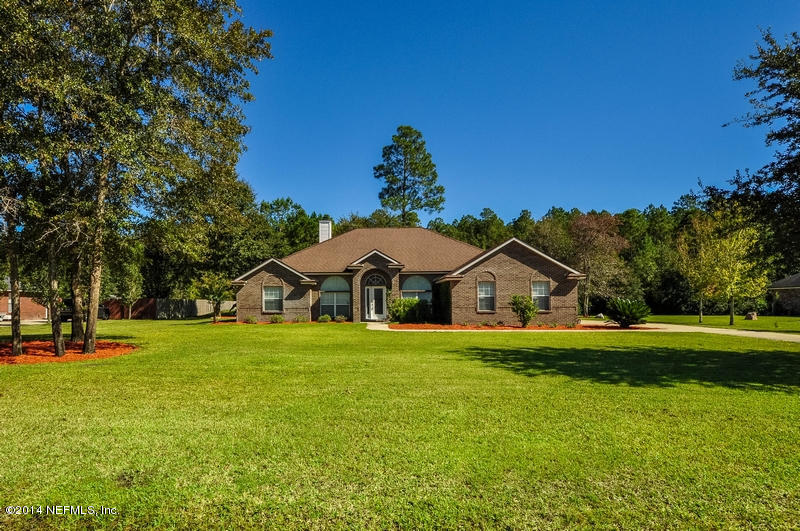 55108 Bear Run Road Callahan, FL 32011 - Photo 1 of 33 a front view of a house with a yard