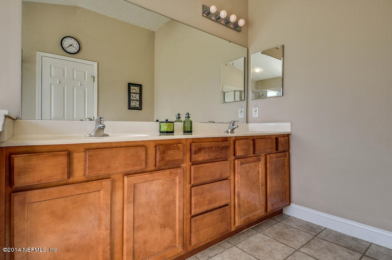 55108 Bear Run Road Callahan, FL 32011 - Photo 20 of 33 a bathroom with a sink and a mirror