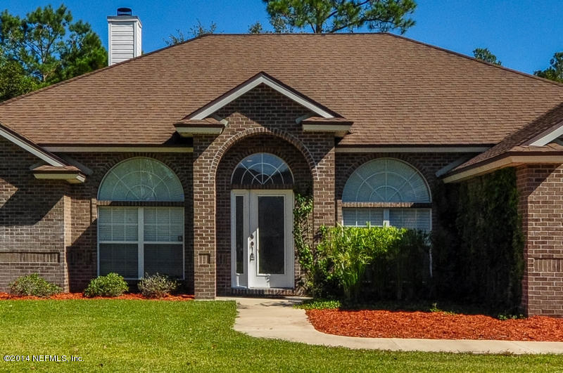 55108 Bear Run Road Callahan, FL 32011 - Photo 2 of 33 a front view of a house with garden
