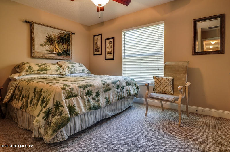 55108 Bear Run Road Callahan, FL 32011 - Photo 23 of 33 a bedroom with a bed and a couch