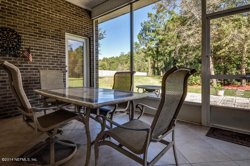 55108 Bear Run Road Callahan, FL 32011 - Photo 25 of 33 a view of a dining room with furniture and window