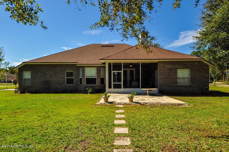 55108 Bear Run Road Callahan, FL 32011 - Photo 26 of 33 a house view with a garden space