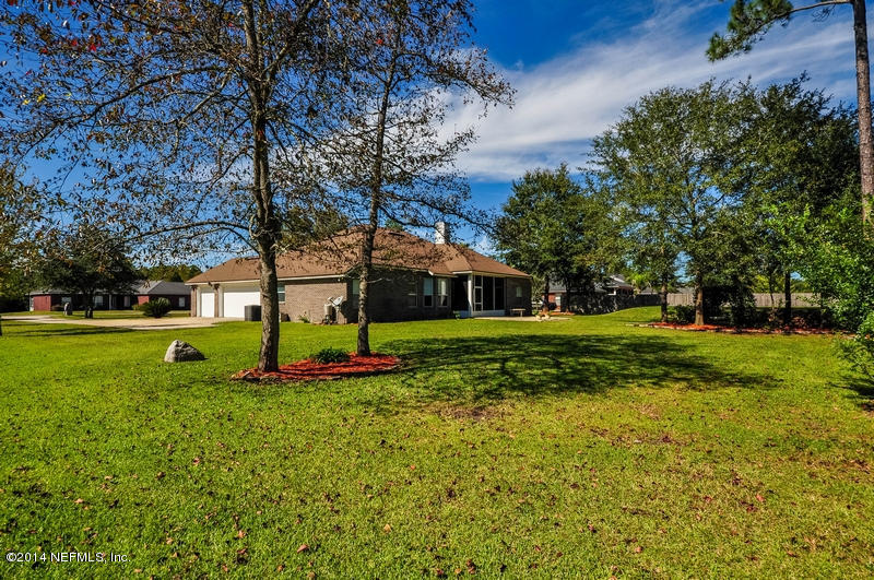 55108 Bear Run Road Callahan, FL 32011 - Photo 29 of 33 a view of a house with a yard