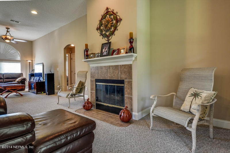 55108 Bear Run Road Callahan, FL 32011 - Photo 7 of 33 a living room with furniture and a fireplace