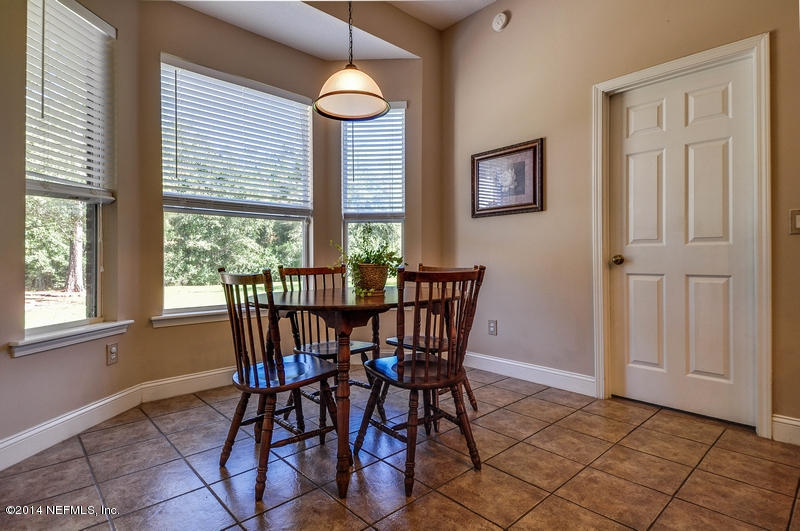 55108 Bear Run Road Callahan, FL 32011 - Photo 9 of 33 a view of a dining room with furniture and a window