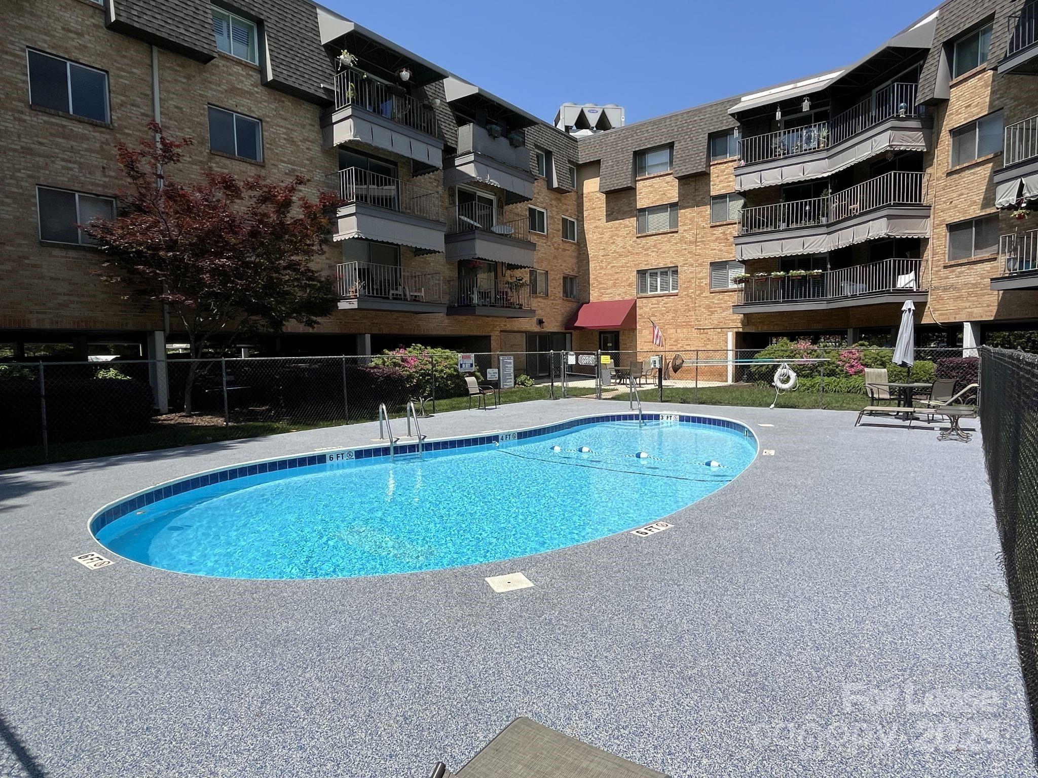 1323 Queens Road, Unit 312 Charlotte, NC 28207 - Photo 30 of 32 a view of pool with outdoor seating