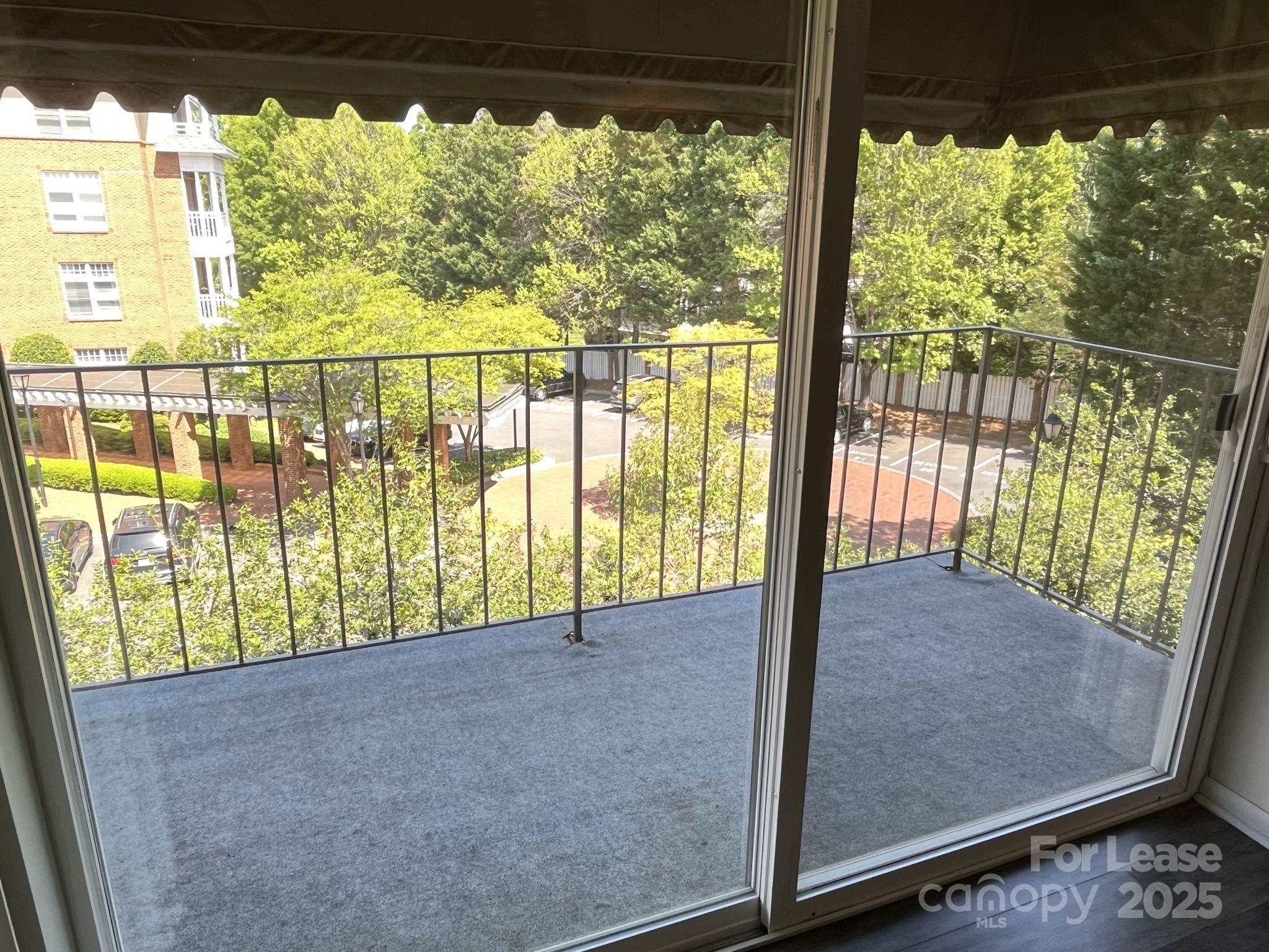 1323 Queens Road, Unit 312 Charlotte, NC 28207 - Photo 7 of 32 a view of large windows and stairs