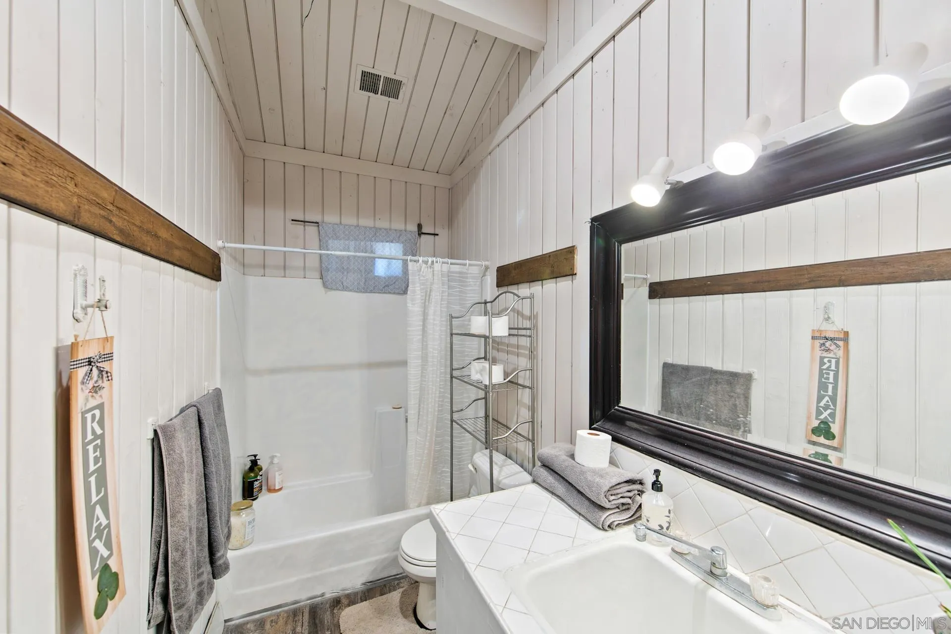 15950 Green Valley Heights Road Ramona, CA 92065 - Photo 13 of 27 a bathroom with a sink and a mirror