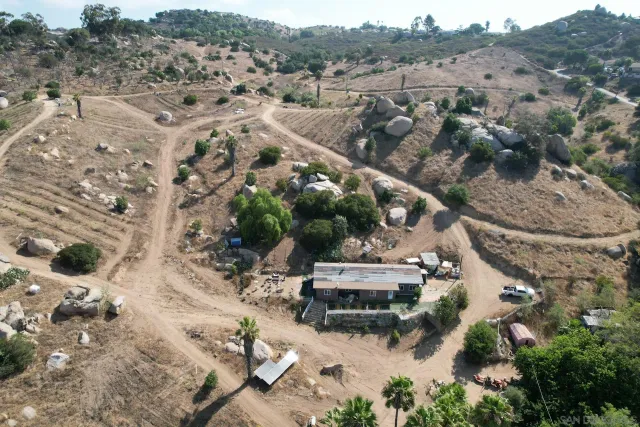 an aerial view of residential house with outdoor space