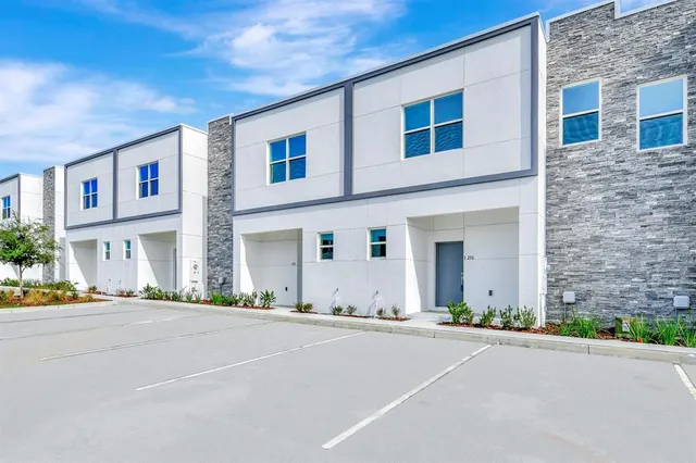 a front view of a building with a road