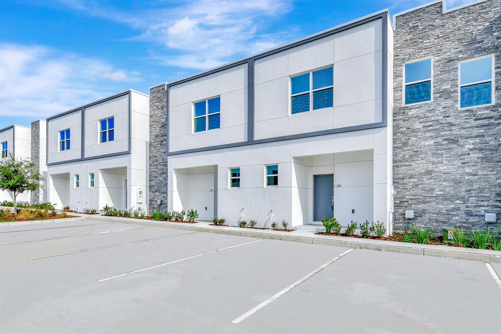a front view of a building with a road