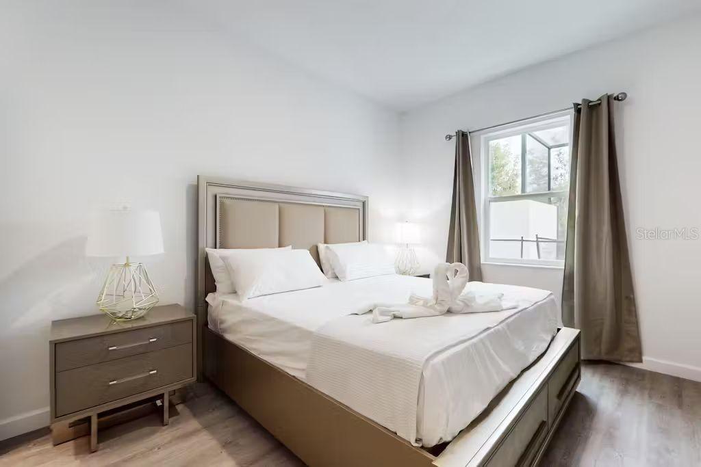 372 Famagusta Drive Davenport, FL 33896 - Photo 11 of 38 a bedroom with a bed and a window