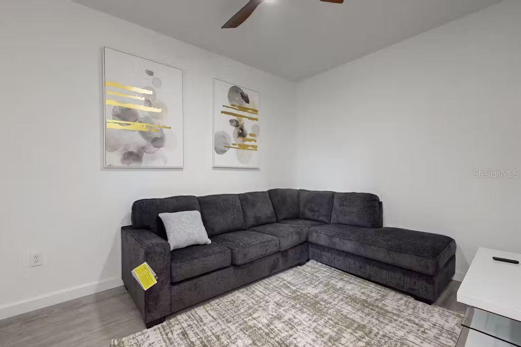372 Famagusta Drive Davenport, FL 33896 - Photo 15 of 38 a living room with furniture and a window