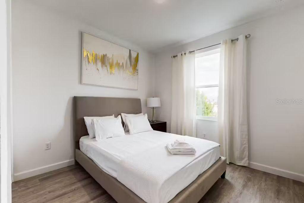 372 Famagusta Drive Davenport, FL 33896 - Photo 20 of 38 a bedroom with a bed and a window