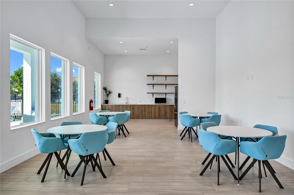 372 Famagusta Drive Davenport, FL 33896 - Photo 26 of 38 a view of a dining room with furniture and wooden floor