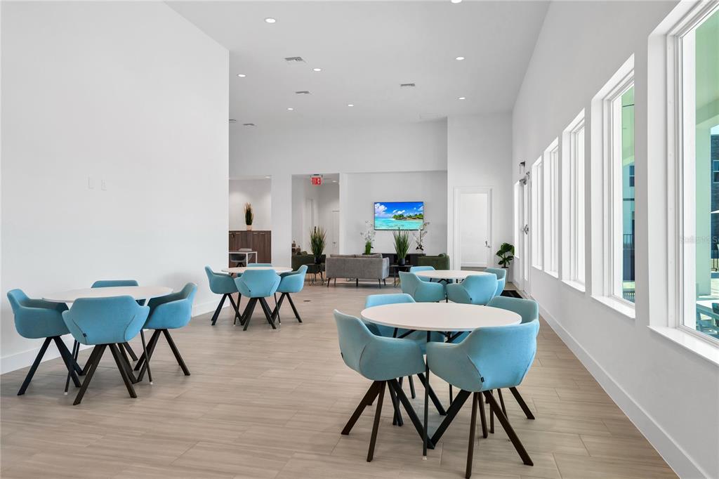 372 Famagusta Drive Davenport, FL 33896 - Photo 27 of 38 a view of a dining room with furniture and wooden floor