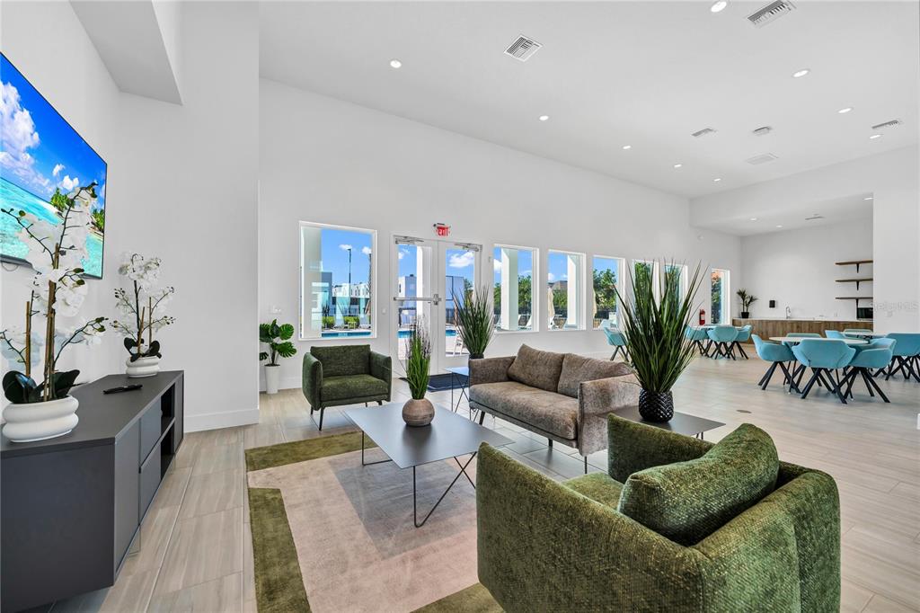 372 Famagusta Drive Davenport, FL 33896 - Photo 30 of 38 a living room with furniture and a potted plant