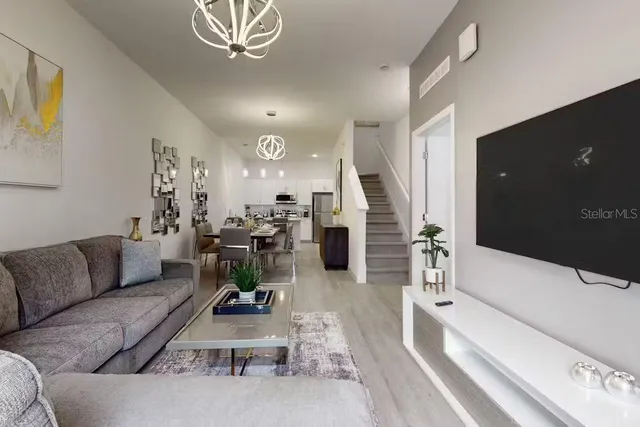 a living room with furniture and a window