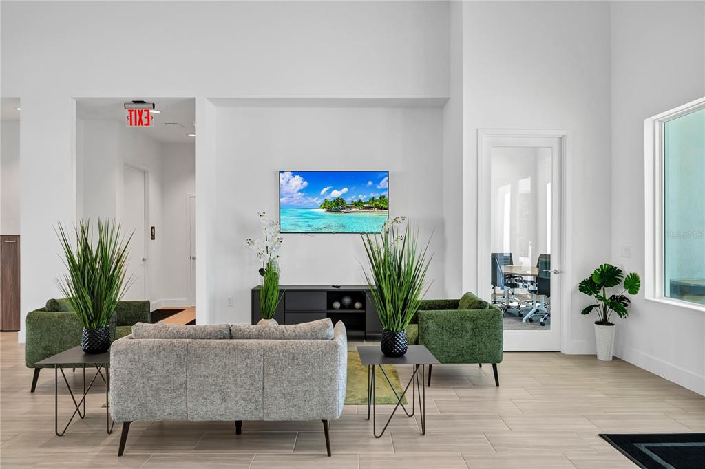 372 Famagusta Drive Davenport, FL 33896 - Photo 31 of 38 a living room with furniture potted plant and a wooden floor