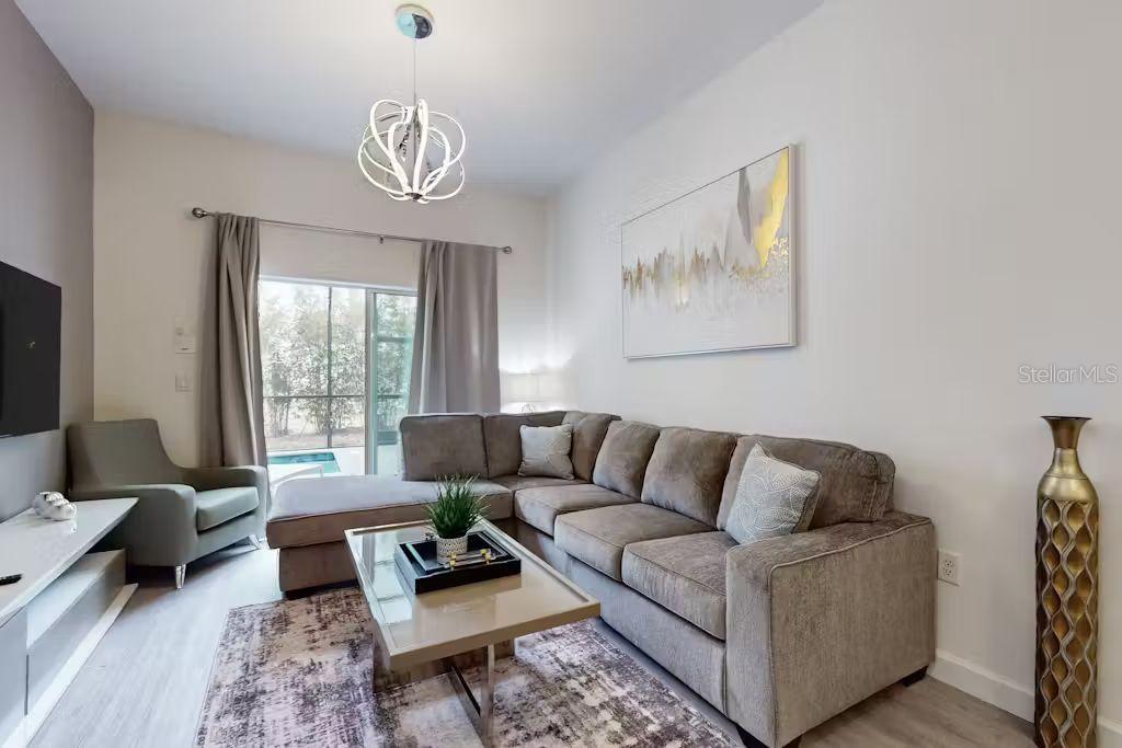 372 Famagusta Drive Davenport, FL 33896 - Photo 5 of 38 a living room with furniture and a window