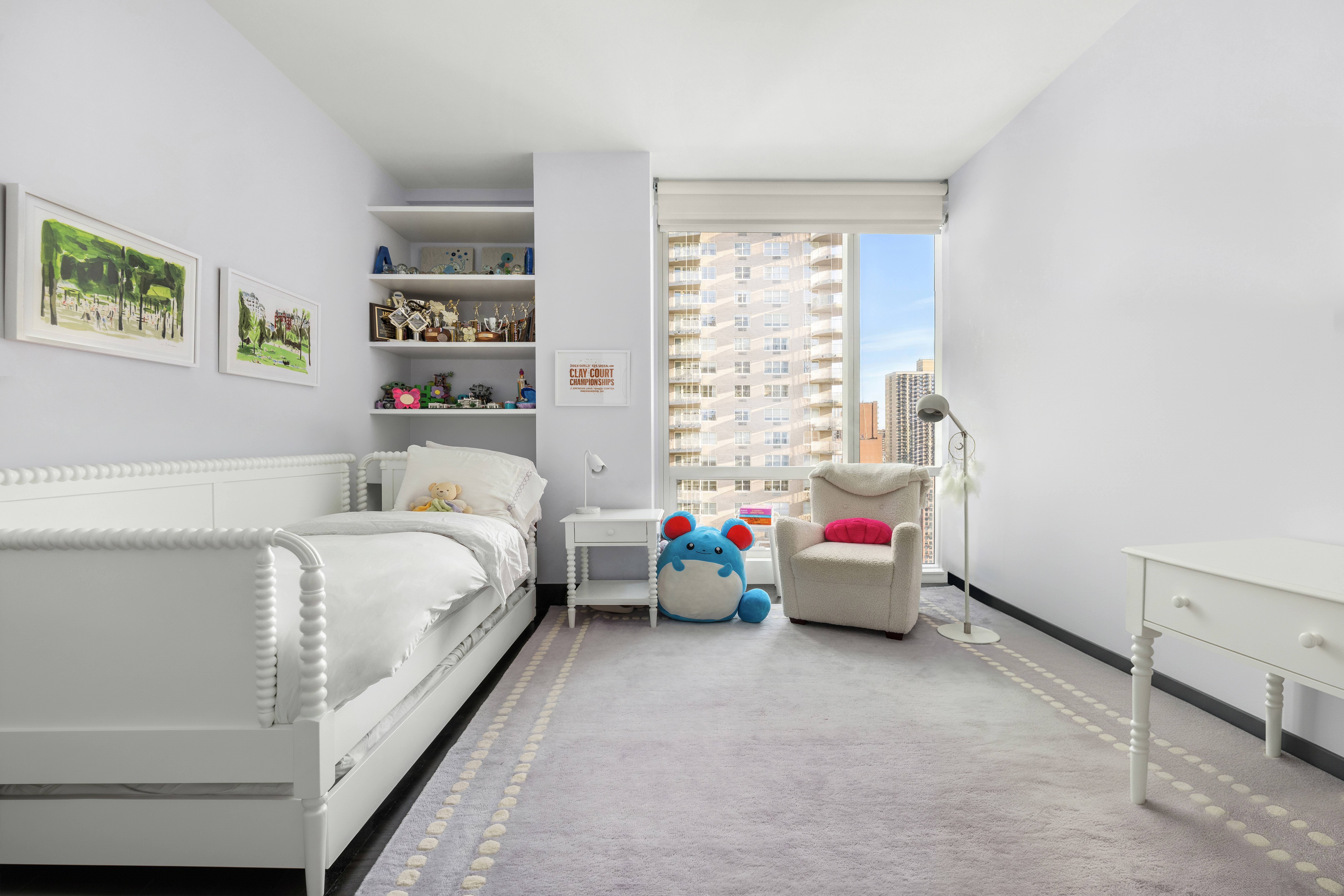 151 East 85th Street, Unit 11C Manhattan, NY 10028 - Photo 11 of 13 a bedroom with bed and wooden floor