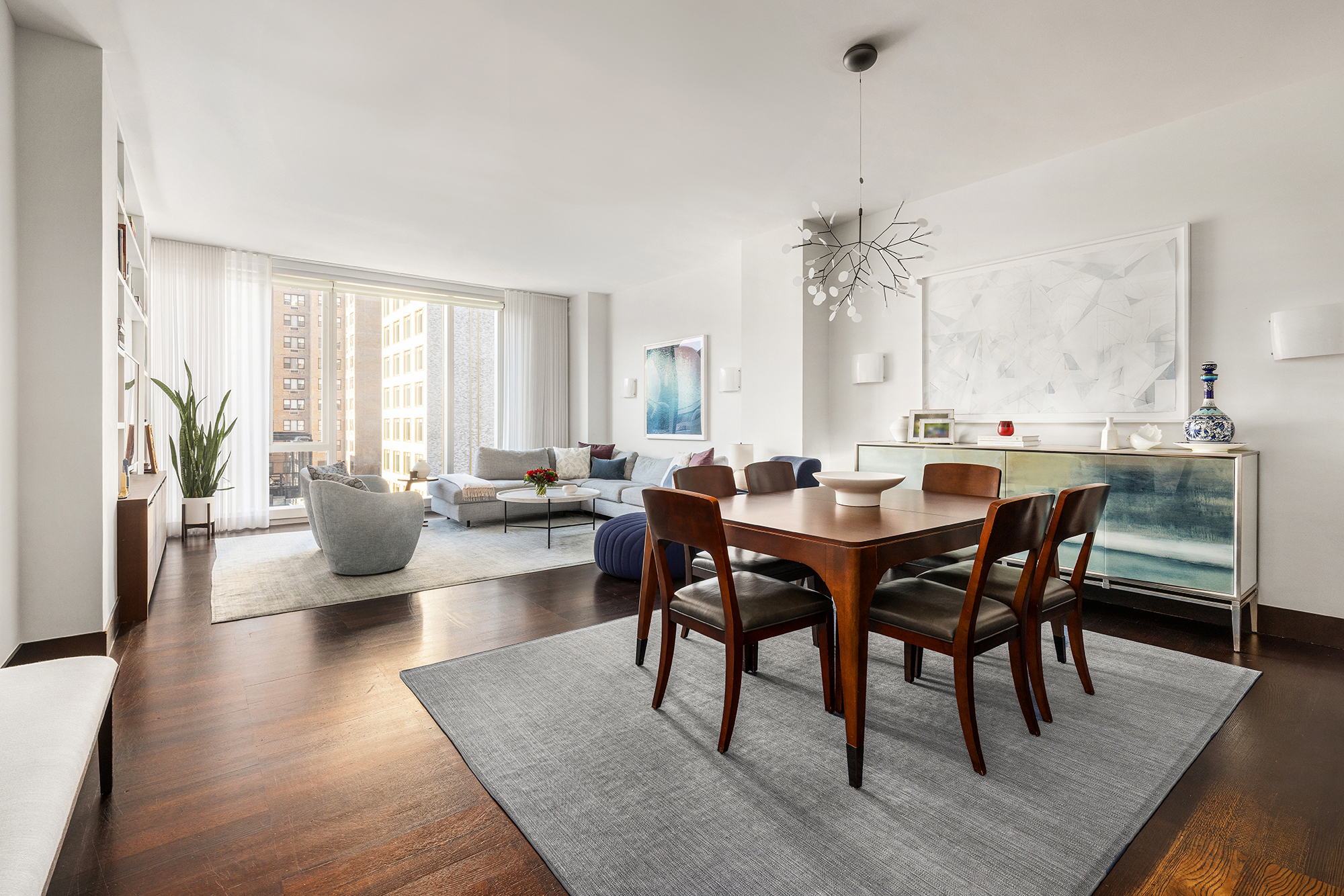 151 East 85th Street, Unit 11C Manhattan, NY 10028 - Photo 2 of 13 a view of a dining room with furniture and wooden floor