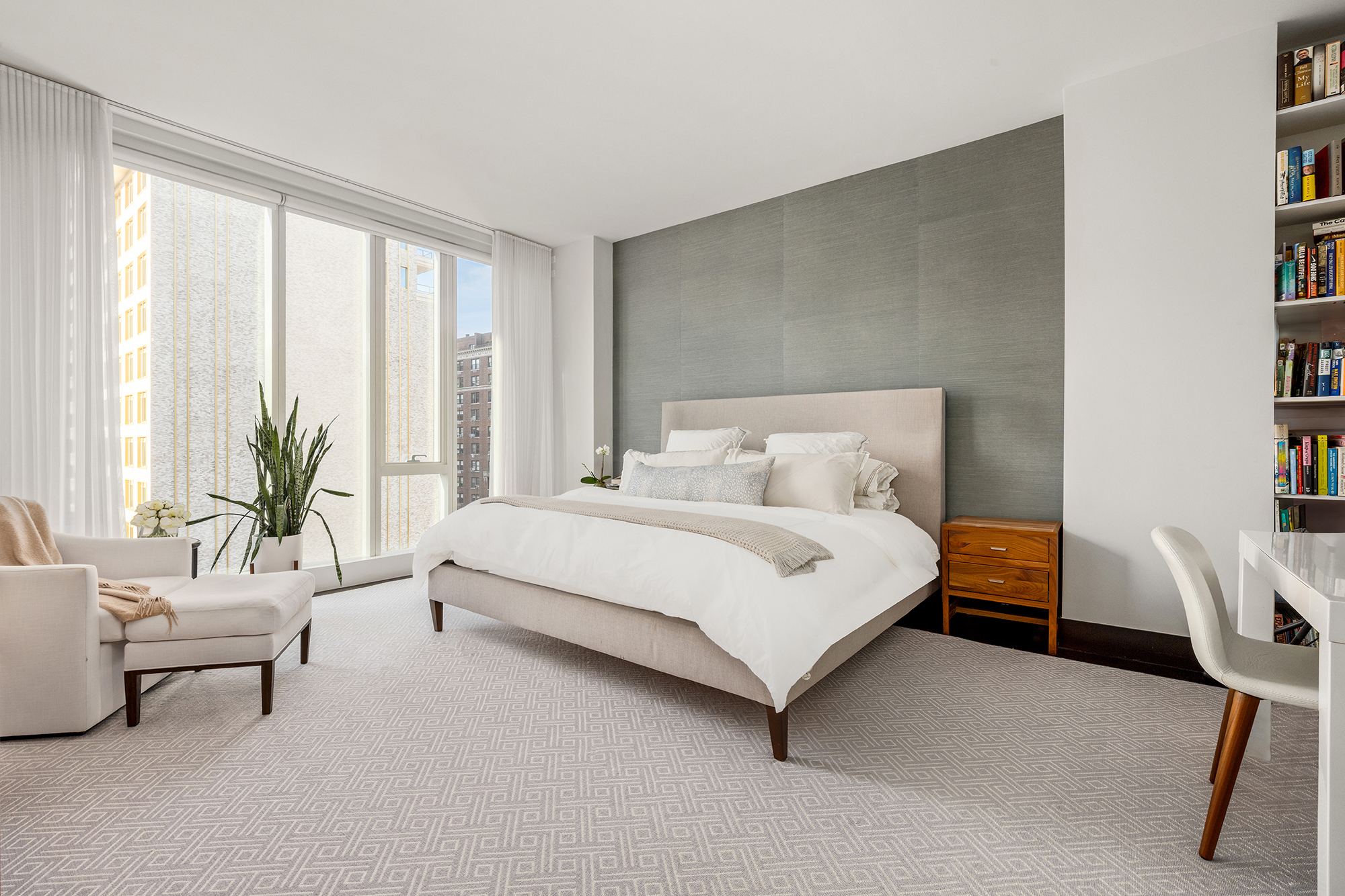 151 East 85th Street, Unit 11C Manhattan, NY 10028 - Photo 7 of 13 a bedroom with a bed and a couch