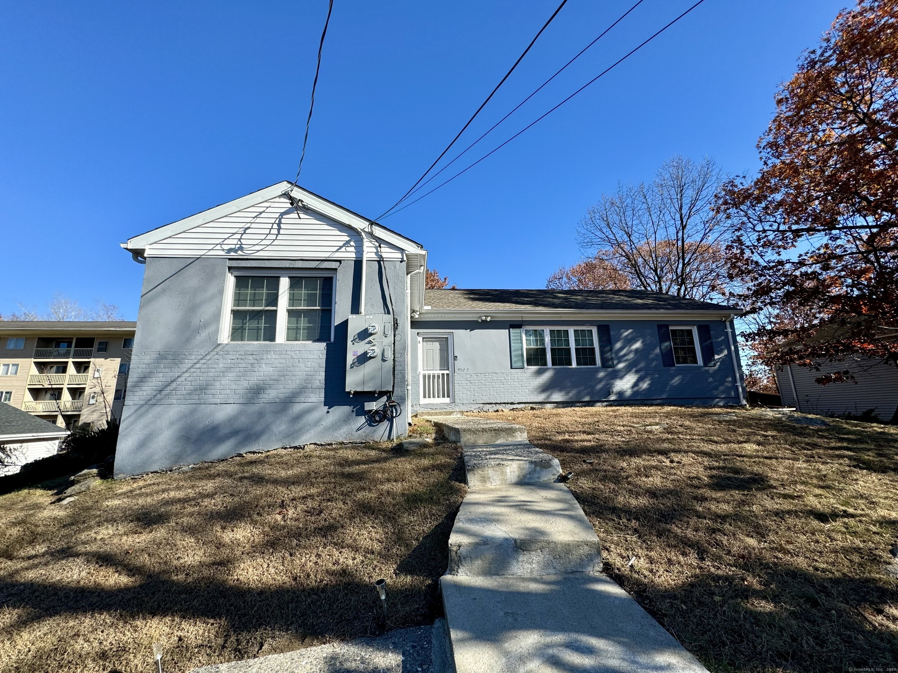 950 Lindley Street Bridgeport, CT 06606 - Photo 1 of 14 a front view of a house with a yard