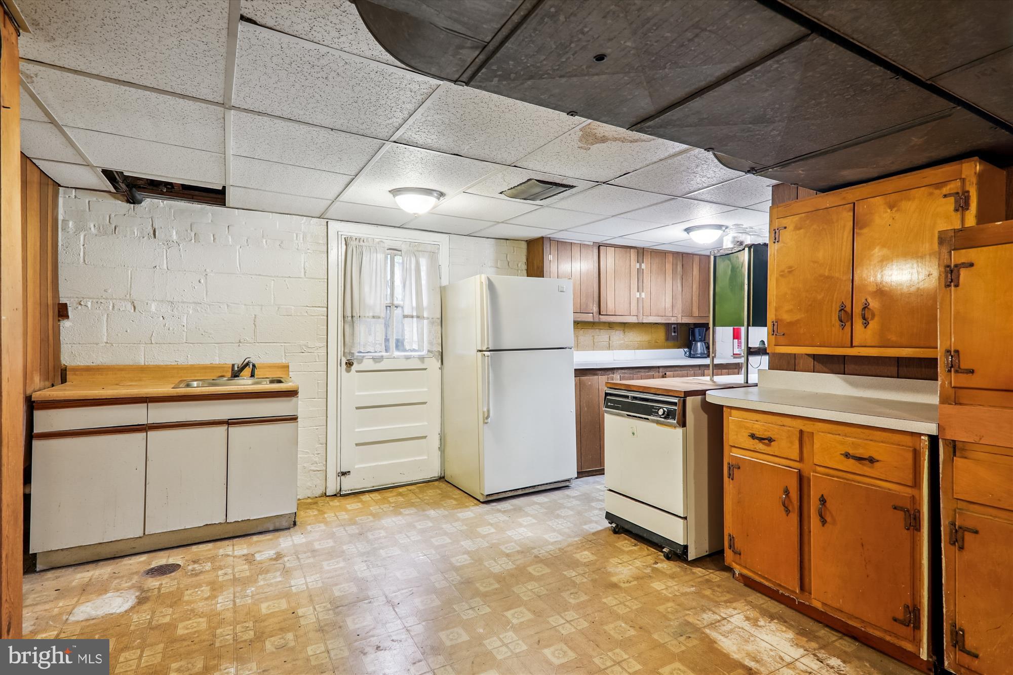 9507 Adelphi Road Silver Spring, MD 20903 - Photo 35 of 41 a kitchen with stainless steel appliances granite countertop a refrigerator and a stove