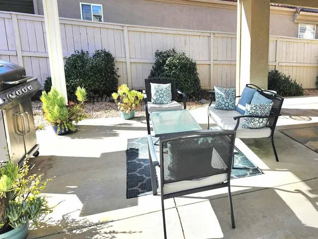 a spacious bedroom with a bed and a cabinets