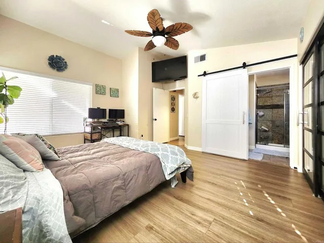 a room with lots of wooden furniture and a view of living room
