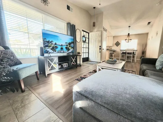 a living room with furniture and a rug