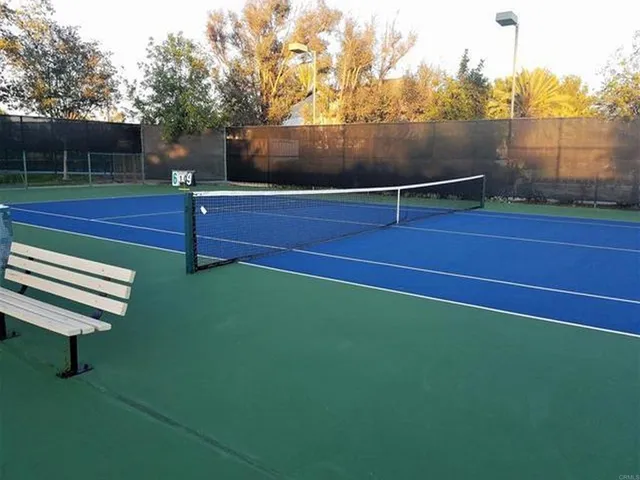 a view of a swimming pool and a yard