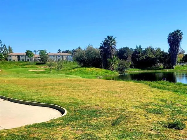 a view of a lake with a house in the background